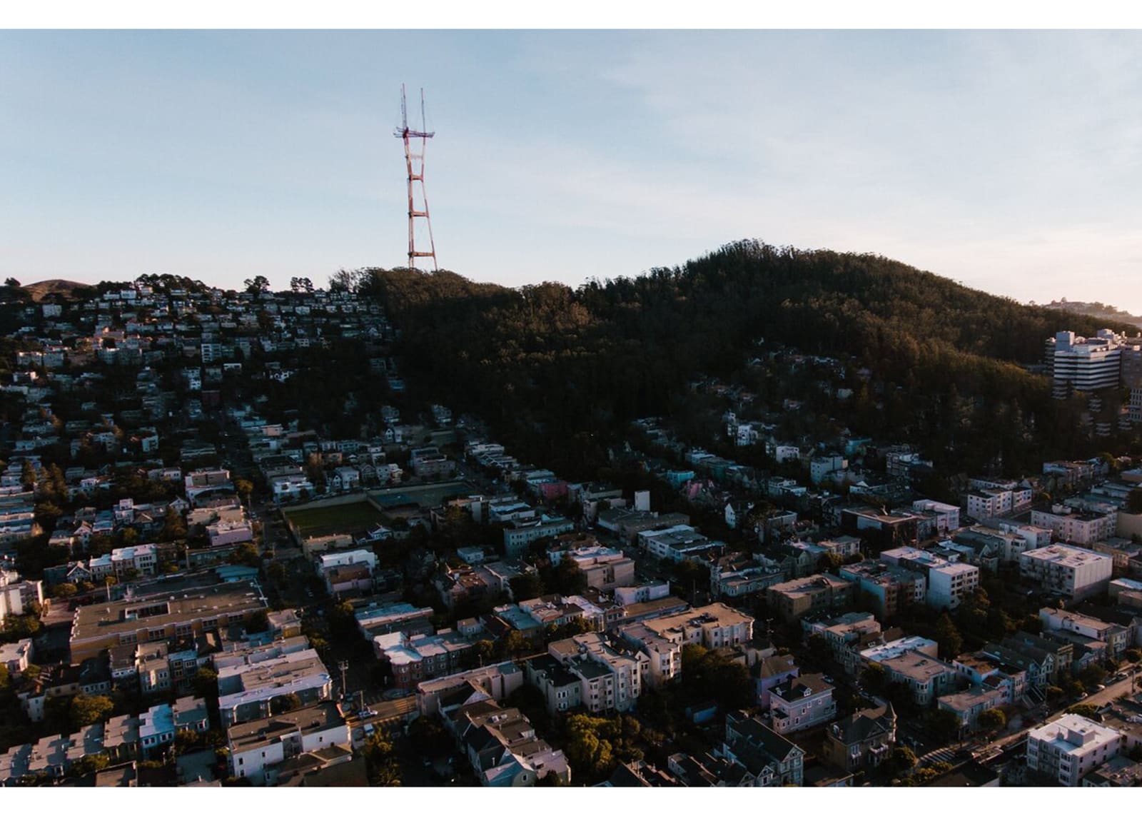 A view across the rooftops of Cole Valley toward Sutro Tower on the hill